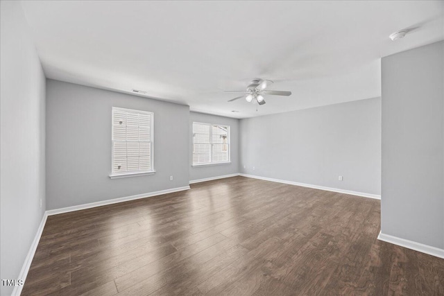 8630 Neuse Lndg Unit 105, Raleigh, NC 27616 - spare room with ceiling fan, wood finished floors, baseboards, and a smoke detector