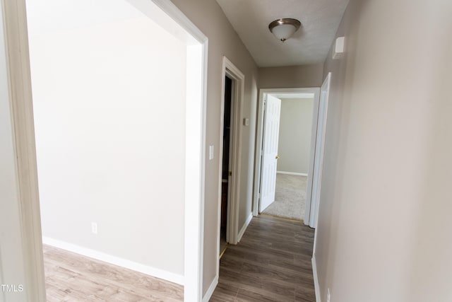 613 Sunnybrook Dr, Hope Mills, NC 28348 - hall with baseboards and wood finished floors