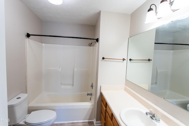 613 Sunnybrook Dr, Hope Mills, NC 28348 - bathroom with toilet, vanity, shower / tub combination, and a textured ceiling