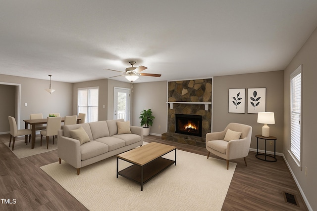 613 Sunnybrook Dr, Hope Mills, NC 28348 - living area with plenty of natural light, dark wood-style floors, and baseboards