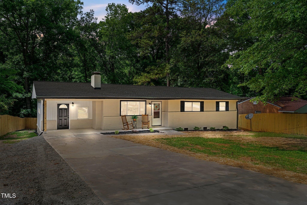 908 W Garden St, Sanford, NC 27330 - ranch-style house featuring driveway and a chimney