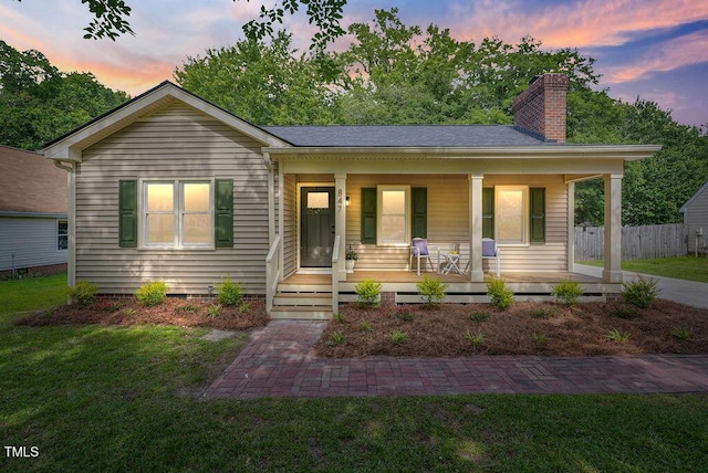 847 E Maple Ln, Fuquay Varina, NC 27526 - bungalow-style home featuring a chimney and a porch