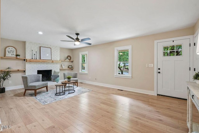 847 E Maple Ln, Fuquay Varina, NC 27526 - living room featuring healthy amount of natural light, a ceiling fan, baseboards, a large fireplace, and recessed lighting