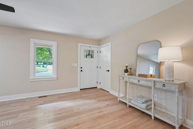 847 E Maple Ln, Fuquay Varina, NC 27526 - entryway featuring light wood-type flooring and baseboards