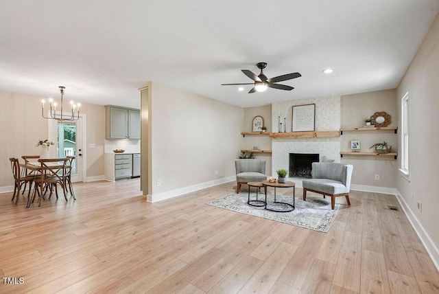 847 E Maple Ln, Fuquay Varina, NC 27526 - sitting room featuring light wood-type flooring, a ceiling fan, a fireplace, baseboards, and recessed lighting