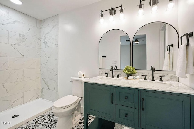 847 E Maple Ln, Fuquay Varina, NC 27526 - bathroom featuring toilet, double vanity, and tiled shower