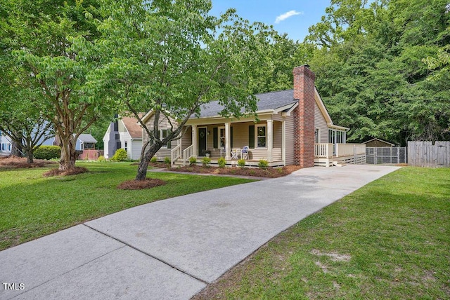 847 E Maple Ln, Fuquay Varina, NC 27526 - view of front of house with driveway, a porch, a chimney, a shingled roof, and a gate