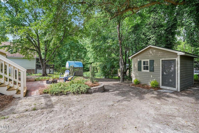 847 E Maple Ln, Fuquay Varina, NC 27526 - view of yard with a patio, a fire pit, and view of scattered trees