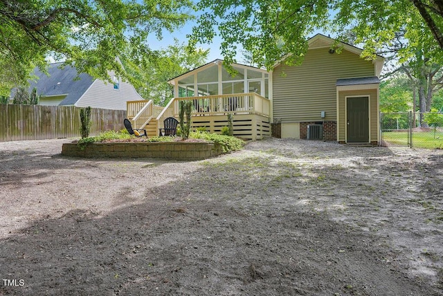 847 E Maple Ln, Fuquay Varina, NC 27526 - rear view of property featuring a sunroom, a deck, central AC, and stairway