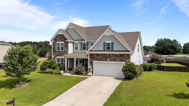 30 Sunbury Ct, Zebulon, NC 27597 - view of front of property with stone siding, driveway, a shingled roof, a garage, and covered porch