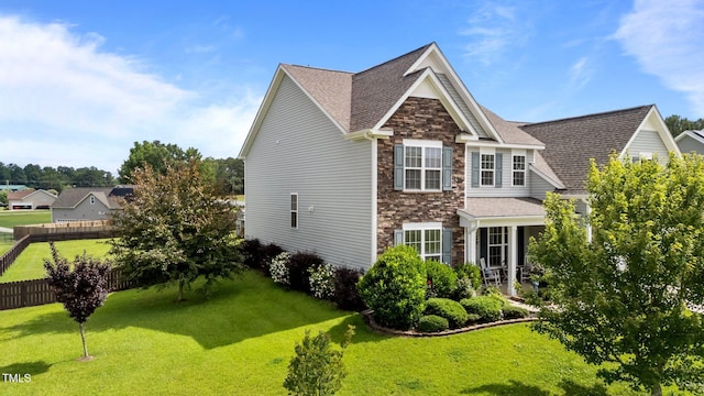 30 Sunbury Ct, Zebulon, NC 27597 - view of home's exterior featuring stone siding and roof with shingles