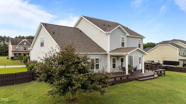 30 Sunbury Ct, Zebulon, NC 27597 - back of property featuring a wooden deck and a shingled roof