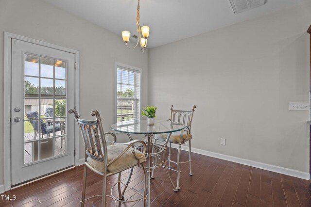 30 Sunbury Ct, Zebulon, NC 27597 - dining room featuring dark wood finished floors, baseboards, and a chandelier