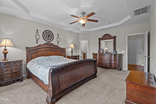 30 Sunbury Ct, Zebulon, NC 27597 - carpeted bedroom with a raised ceiling, baseboards, and ceiling fan