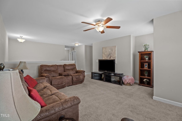 30 Sunbury Ct, Zebulon, NC 27597 - living area with a ceiling fan, carpet, and baseboards