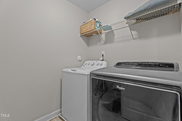 30 Sunbury Ct, Zebulon, NC 27597 - washroom with washer and clothes dryer and baseboards
