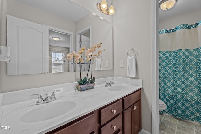 30 Sunbury Ct, Zebulon, NC 27597 - full bathroom featuring toilet, double vanity, and a shower with curtain