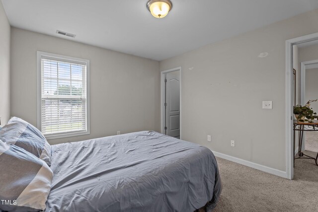 30 Sunbury Ct, Zebulon, NC 27597 - bedroom featuring carpet floors and baseboards
