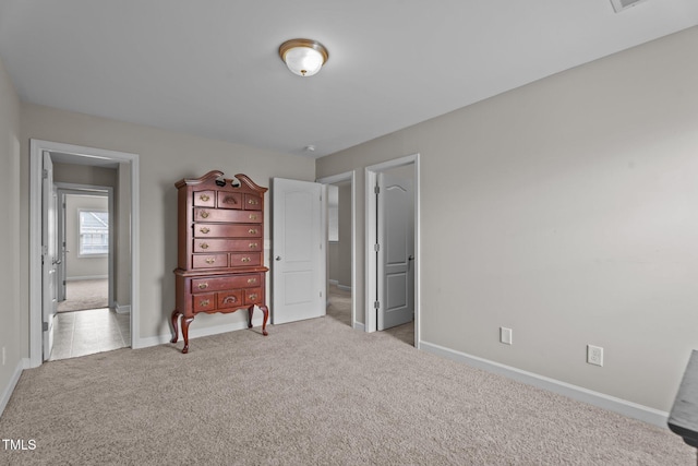 30 Sunbury Ct, Zebulon, NC 27597 - bedroom with light carpet and baseboards