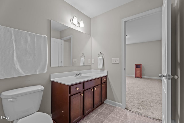 30 Sunbury Ct, Zebulon, NC 27597 - bathroom with vanity, toilet, tile patterned floors, and baseboards