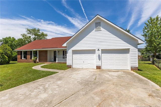 ranch-style home with driveway, a garage, and covered porch