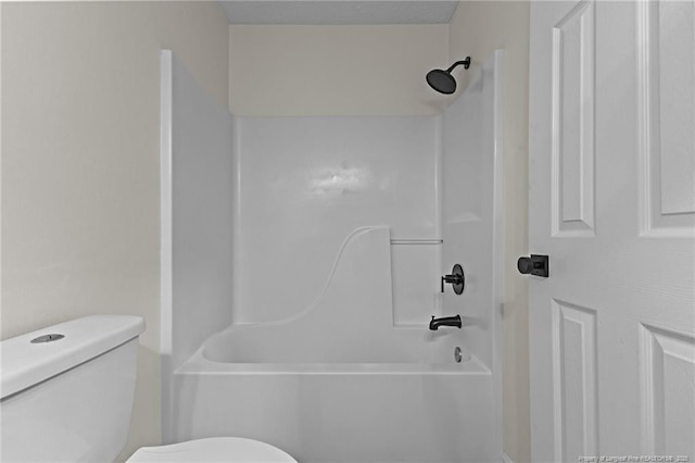 full bathroom featuring toilet and bathing tub / shower combination