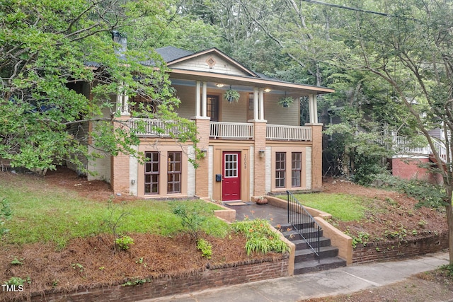 1008 Dorothea Dr, Raleigh, NC 27603 - neoclassical / greek revival house featuring french doors, a porch, and brick siding