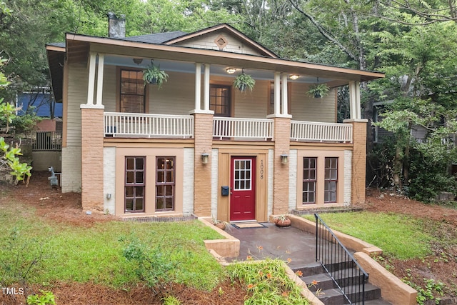1008 Dorothea Dr, Raleigh, NC 27603 - view of front of home featuring a balcony and a chimney