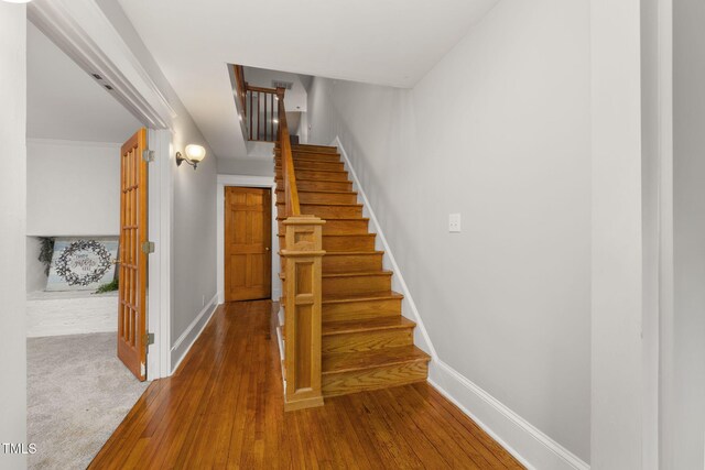 1008 Dorothea Dr, Raleigh, NC 27603 - stairway with baseboards and wood-type flooring