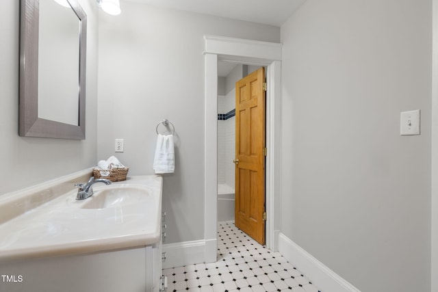 1008 Dorothea Dr, Raleigh, NC 27603 - bathroom featuring vanity, baseboards, and washtub / shower combination