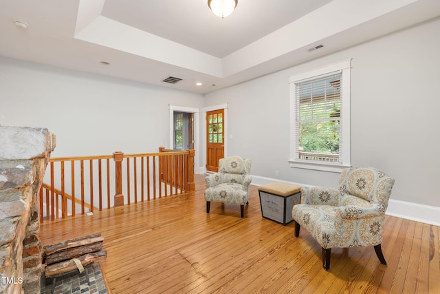1008 Dorothea Dr, Raleigh, NC 27603 - living area featuring wood-type flooring, an upstairs landing, a raised ceiling, baseboards, and recessed lighting