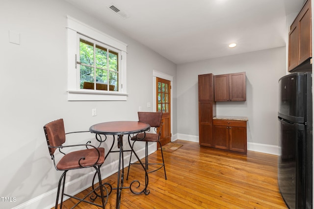 1008 Dorothea Dr, Raleigh, NC 27603 - dining area featuring baseboards, light wood finished floors, and recessed lighting