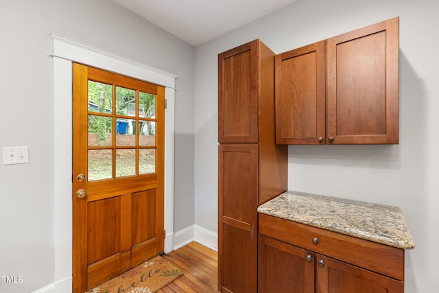 1008 Dorothea Dr, Raleigh, NC 27603 - doorway to outside with baseboards and wood finished floors