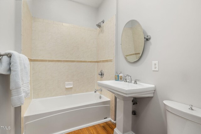 1008 Dorothea Dr, Raleigh, NC 27603 - full bathroom with toilet, tub / shower combination, and wood finished floors