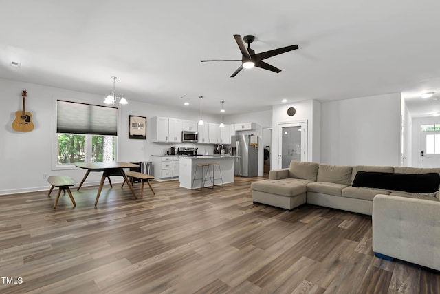 136 Hatchet Cv, Louisburg, NC 27549 - living area featuring ceiling fan, wood finished floors, baseboards, and recessed lighting