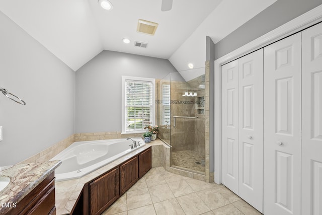 1007 Surry Dale Ct, Apex, NC 27502 - bathroom featuring a closet, a bath, a stall shower, vaulted ceiling, and recessed lighting
