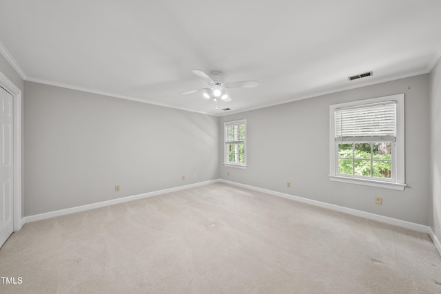 1007 Surry Dale Ct, Apex, NC 27502 - empty room with crown molding, baseboards, ceiling fan, and light colored carpet