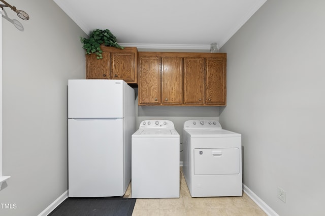 1007 Surry Dale Ct, Apex, NC 27502 - laundry area featuring washing machine and dryer, crown molding, cabinet space, and baseboards