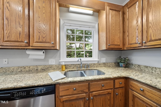 1007 Surry Dale Ct, Apex, NC 27502 - kitchen with stainless steel dishwasher, a sink, brown cabinets, and light stone counters