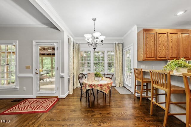 1007 Surry Dale Ct, Apex, NC 27502 - dining area with a chandelier, ornamental molding, dark wood-style floors, baseboards, and recessed lighting