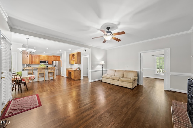 1007 Surry Dale Ct, Apex, NC 27502 - living area with ceiling fan, a chandelier, dark wood finished floors, ornamental molding, and baseboards