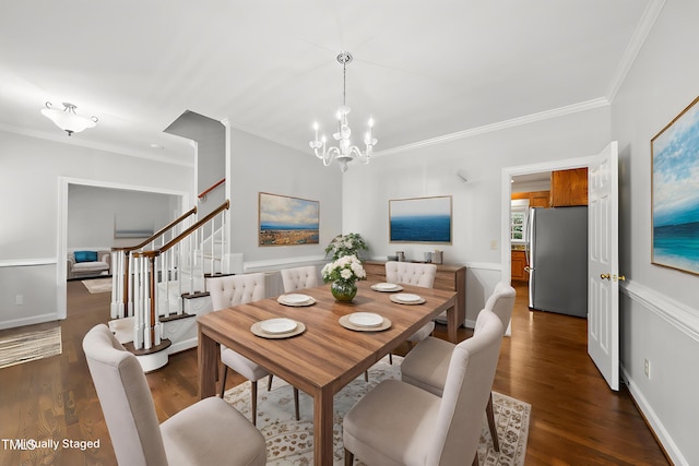 1007 Surry Dale Ct, Apex, NC 27502 - dining room with a chandelier, crown molding, stairs, and dark wood finished floors