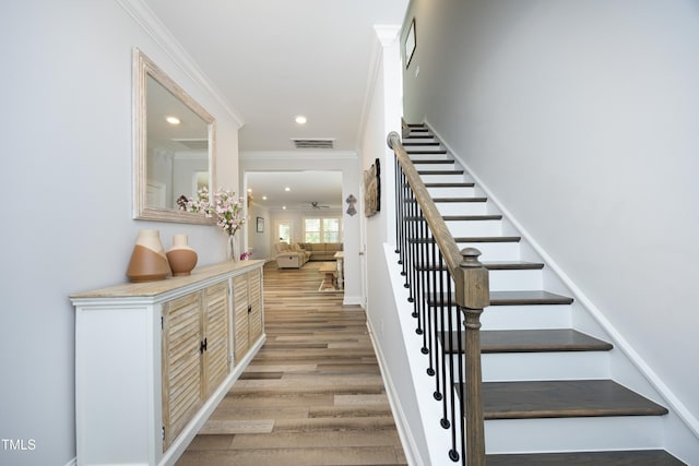 2264 Jollay St, Durham, NC 27703 - staircase featuring crown molding, wood finished floors, recessed lighting, and baseboards