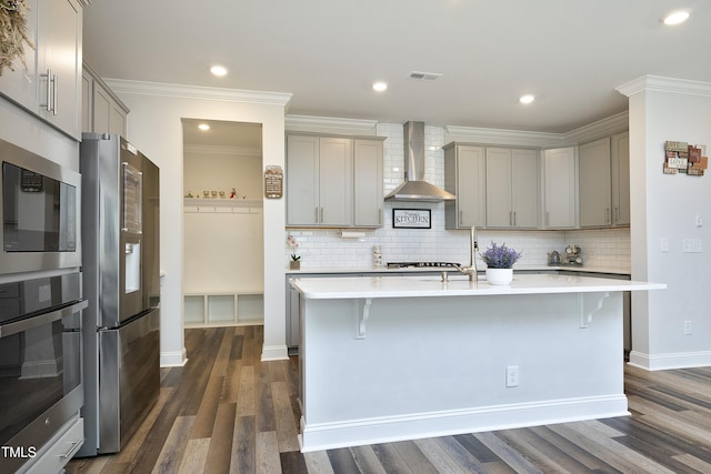 2264 Jollay St, Durham, NC 27703 - kitchen featuring wall chimney exhaust hood, gray cabinets, appliances with stainless steel finishes, ornamental molding, and recessed lighting