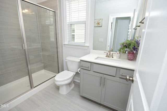 2264 Jollay St, Durham, NC 27703 - bathroom with toilet, vanity, a stall shower, baseboards, and tile patterned flooring