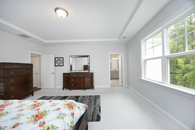 2264 Jollay St, Durham, NC 27703 - bedroom featuring a tray ceiling, carpet, baseboards, and ensuite bathroom