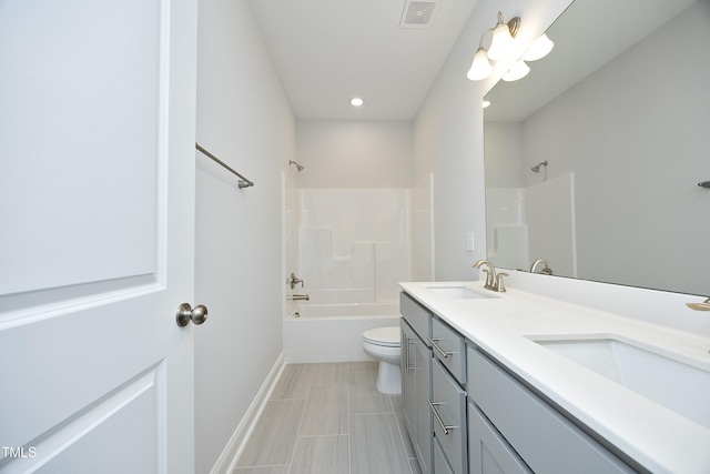 2264 Jollay St, Durham, NC 27703 - bathroom with double vanity, shower / washtub combination, toilet, baseboards, and recessed lighting