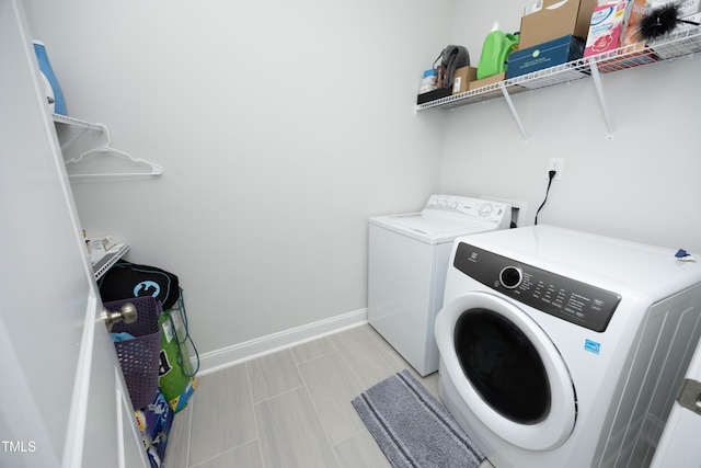 2264 Jollay St, Durham, NC 27703 - washroom with washing machine and clothes dryer and baseboards