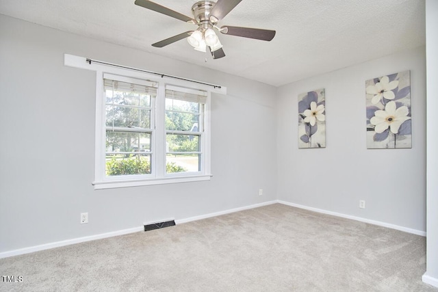 2616 Kirk Rd, Durham, NC 27705 - spare room featuring carpet floors, ceiling fan, baseboards, and a textured ceiling