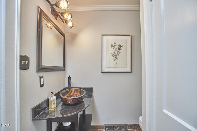 2616 Kirk Rd, Durham, NC 27705 - bathroom with toilet, a sink, crown molding, and baseboards